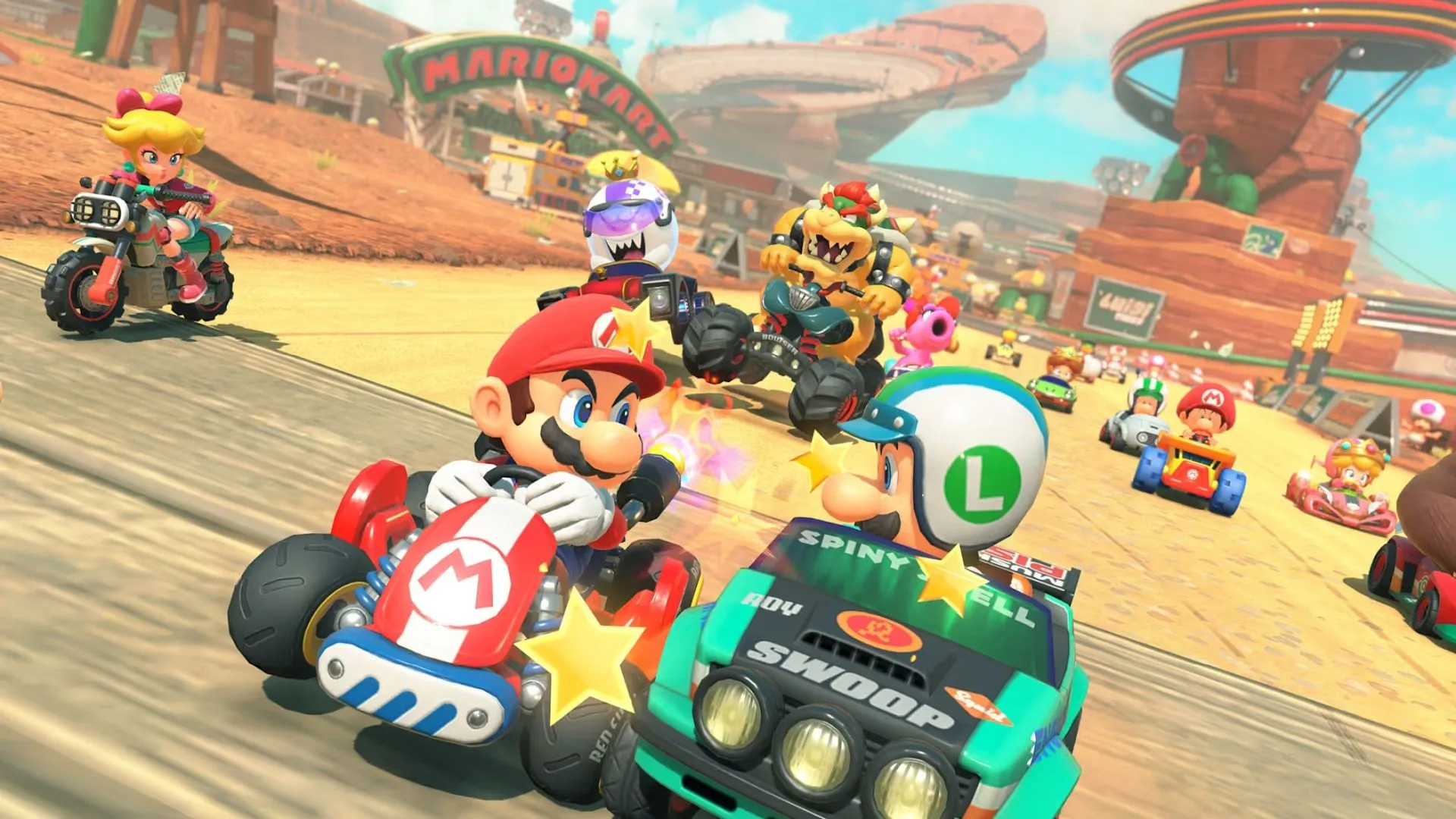 Các nhân vật Mario Kart World đua trên đường đua cổ điển với lâu đài Peach ở phía xa.