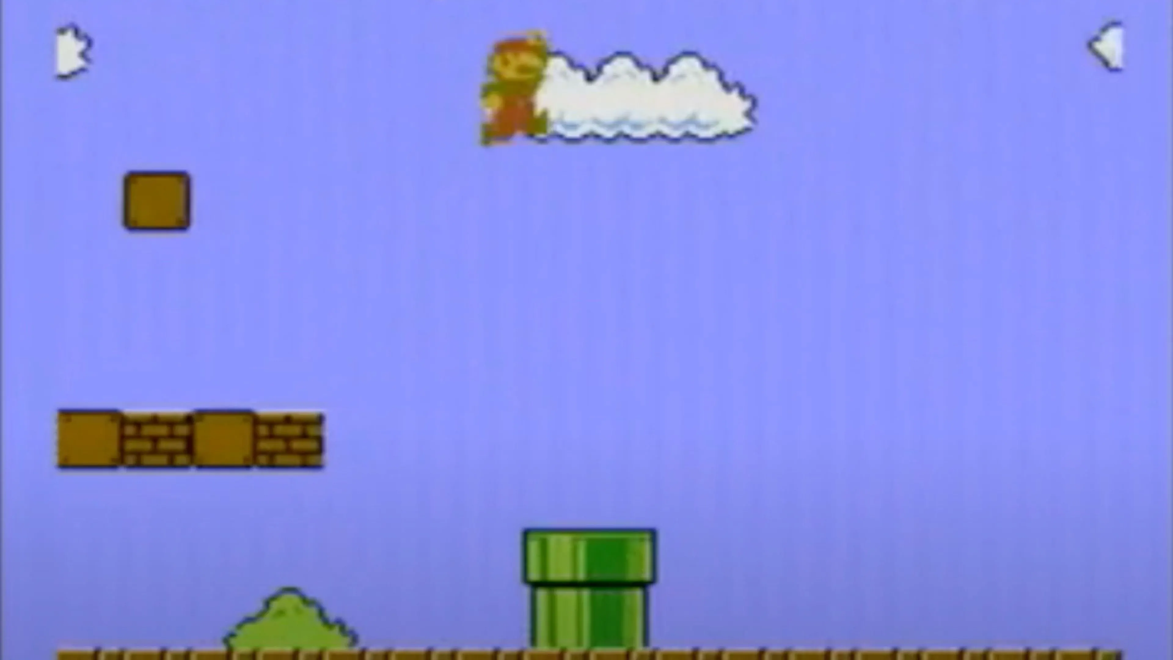 Cảnh chơi game Super Mario Bros. với Mario đang chạy qua các khối và kẻ thù.