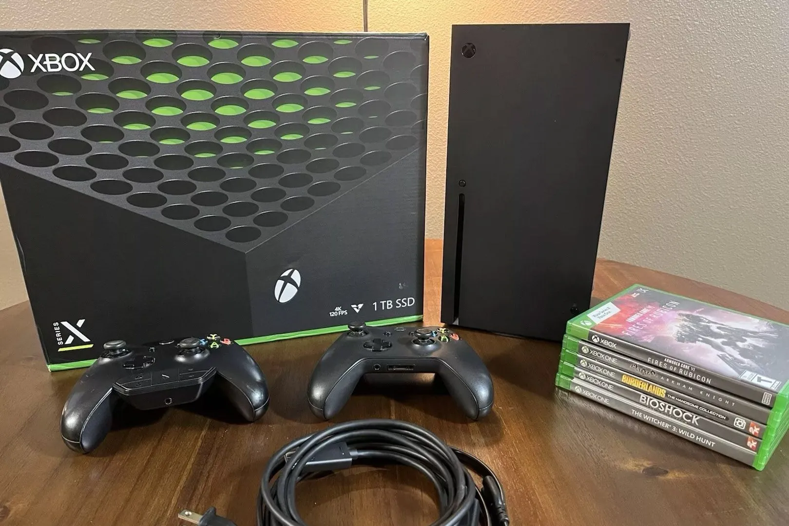 Console Xbox Series X và các bìa game, thể hiện tính năng Quick Resume