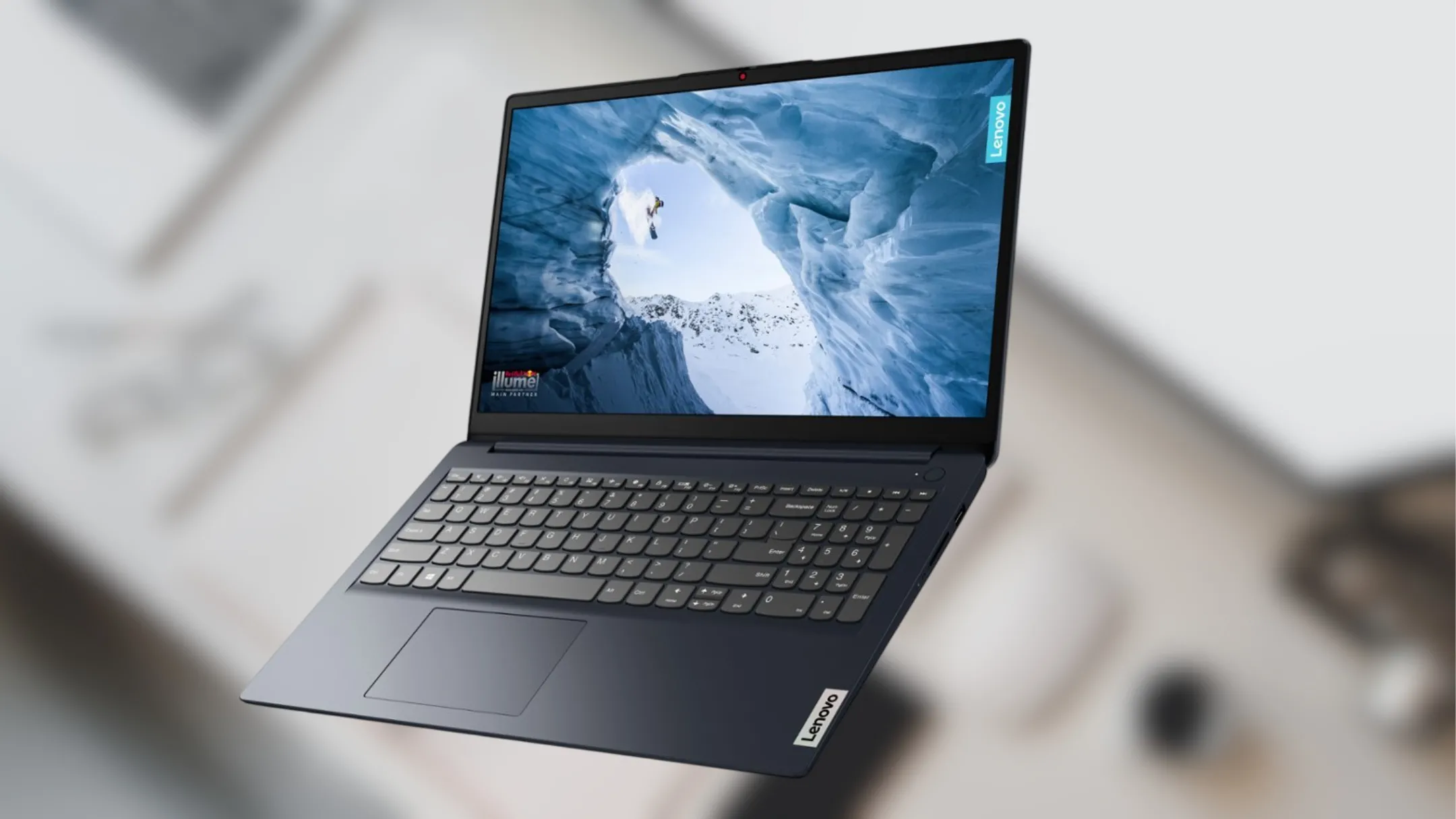 Laptop Lenovo IdeaPad 1i màu xanh, màn hình hiển thị giao diện Windows trên bàn làm việc