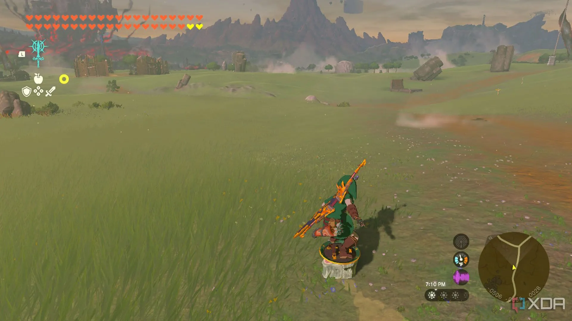 Link đang lướt khiên trên một miếng thịt đông lạnh qua cánh đồng trong Zelda TotK