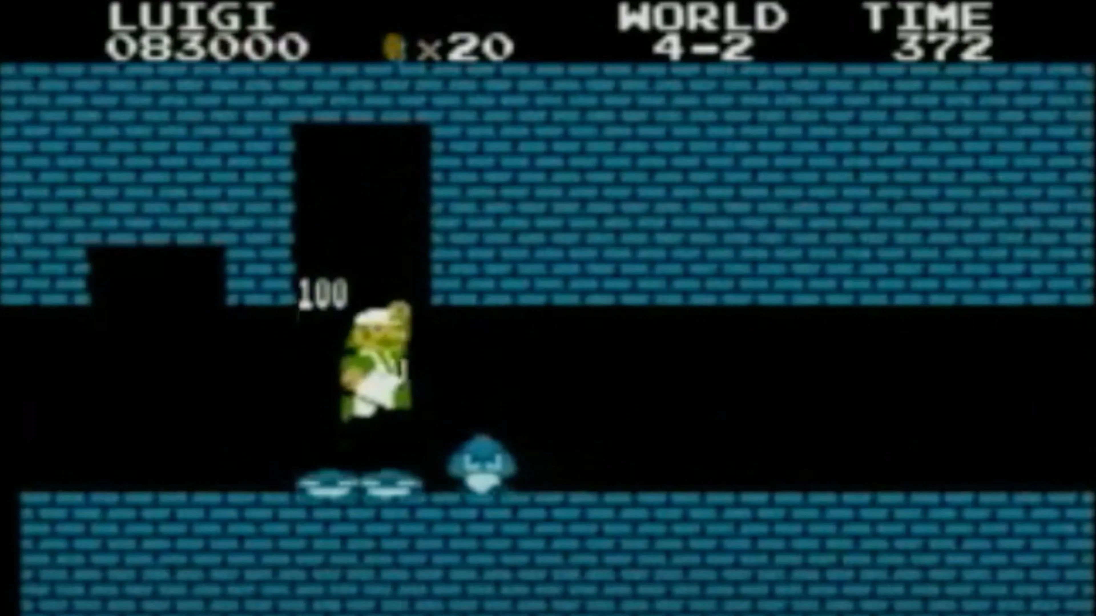 Mario đang nhảy lên một bậc thang trong Super Mario Bros., với phông nền là lâu đài của Bowser.
