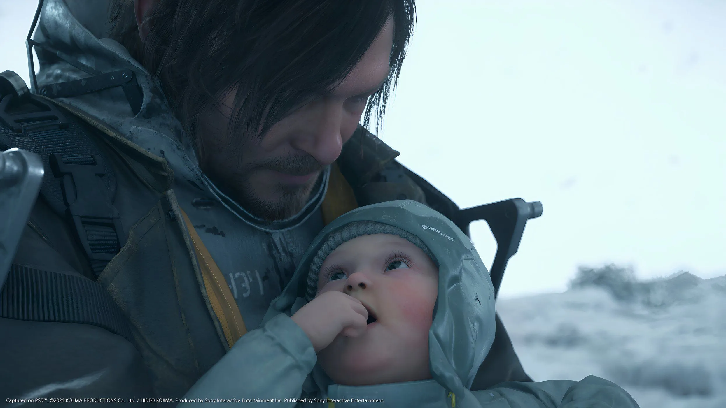Sam Porter Bridges và BB trong Death Stranding 2: On the Beach, minh họa yếu tố cốt truyện bí ẩn và hành trình vận chuyển hàng hóa đặc trưng của game.