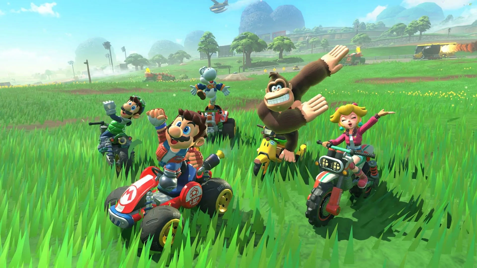 Shy Guy đang đua trên đường phố thành phố Crown City vào ban đêm trong Mario Kart World.