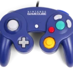 Tay cầm GameCube Nintendo Switch 2 màu xanh dương được đặt trên bề mặt phẳng, cho thấy rõ các nút bấm và cần gạt đặc trưng.