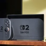 Thiết bị Nintendo Switch 2 và camera trên bàn, minh họa tính năng chuyển dữ liệu hệ thống mới cho máy chơi game.